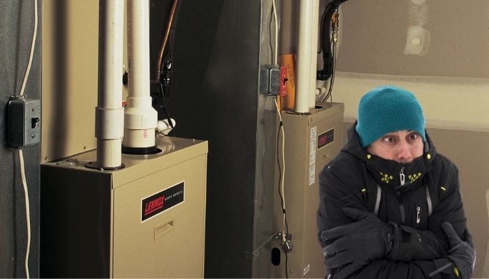 Man freezing in front of his furnace because it is not working